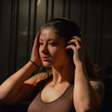 Portrait of Ashley, an Abslim customer sharing her home workout experience